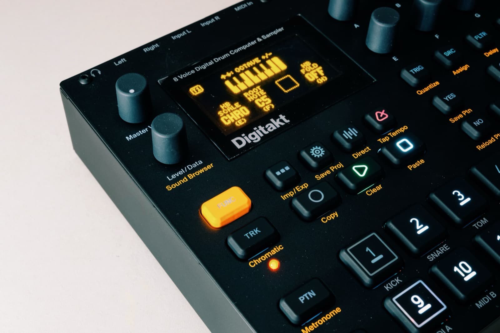 Close-up of a digital drum machine and sampler controls