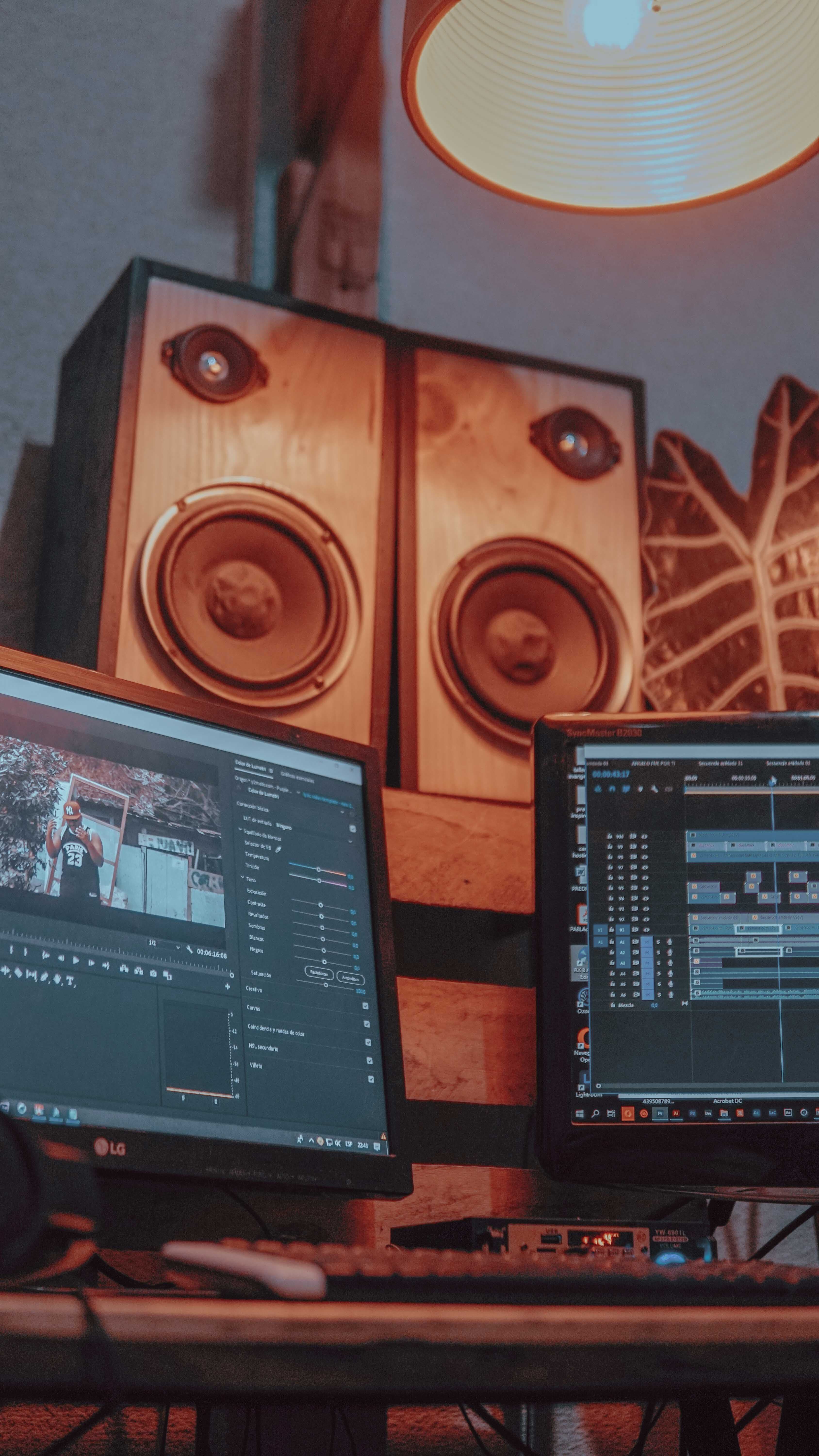 Dual-monitor video editing workstation used to prepare rental gear for a booking