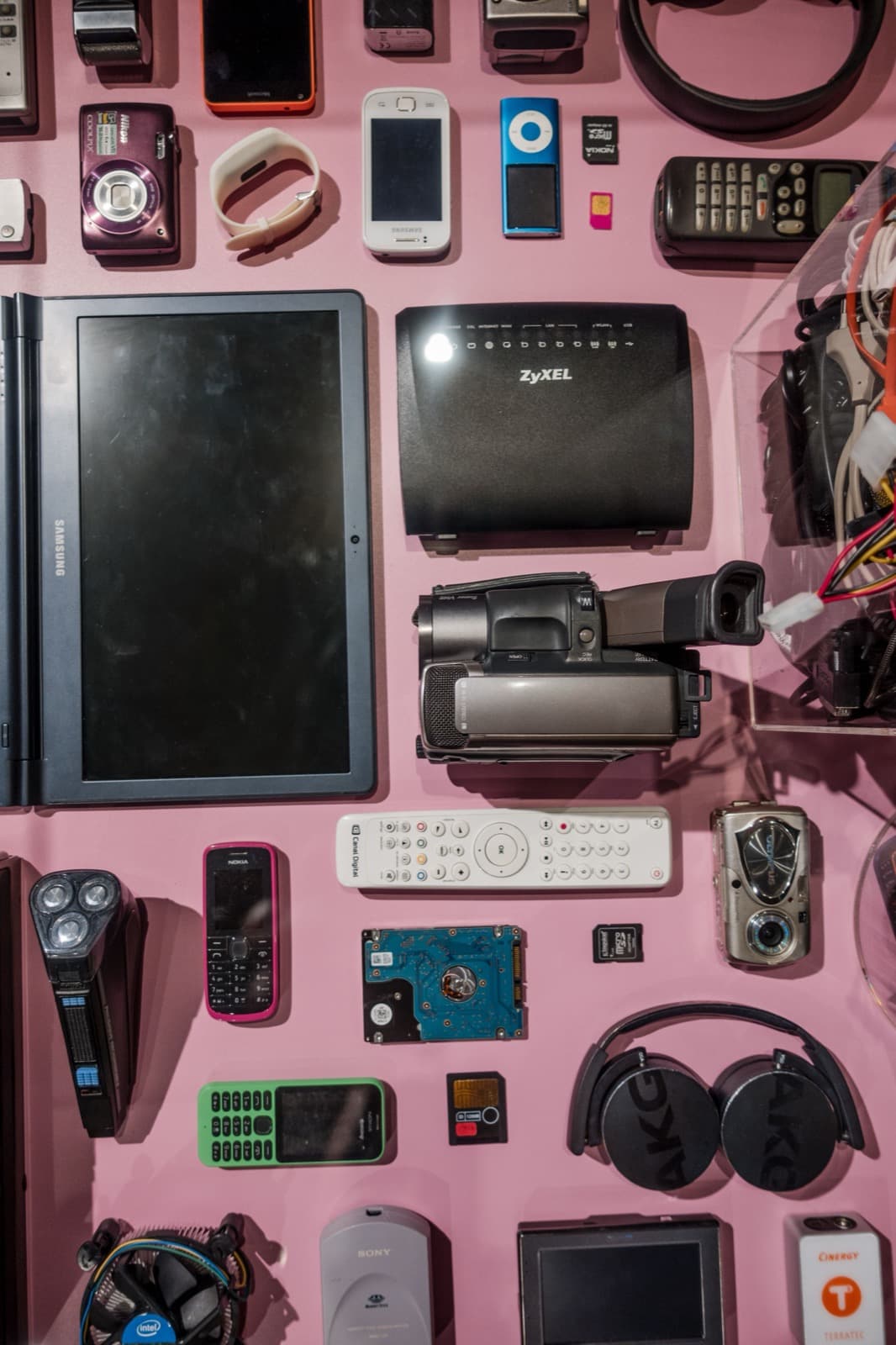 Flatlay of used phones, cameras and gadgets for resale