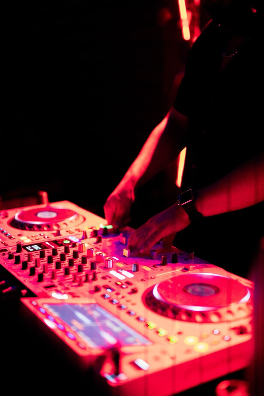DJ controller with glowing red lighting