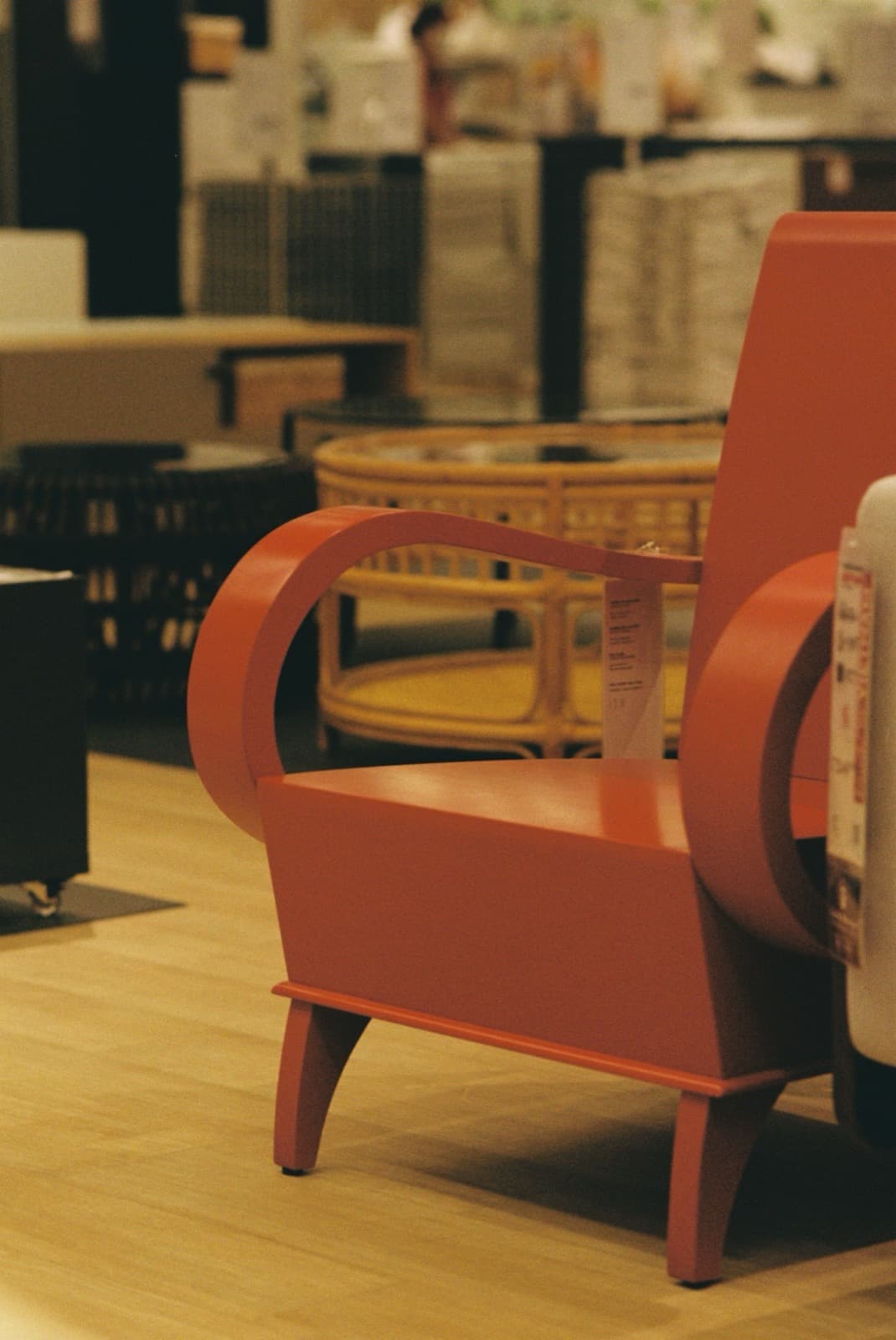 Close-up of an orange armchair in a furniture showroom